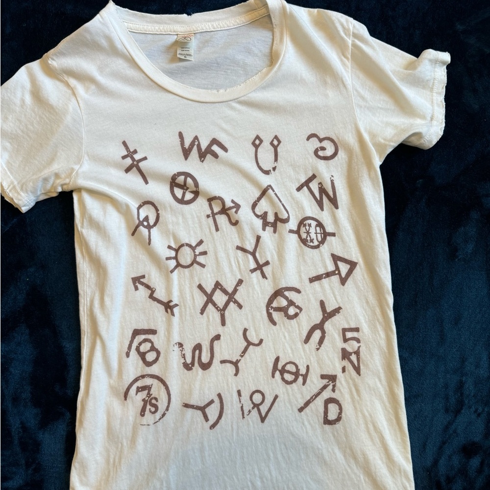 The is a savannah 7’s boutique branded destructed with a few rhinestones tee.